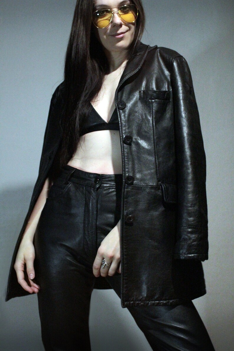 Vintage  leather blazer with high waisted leather pants and aviator sunglasses