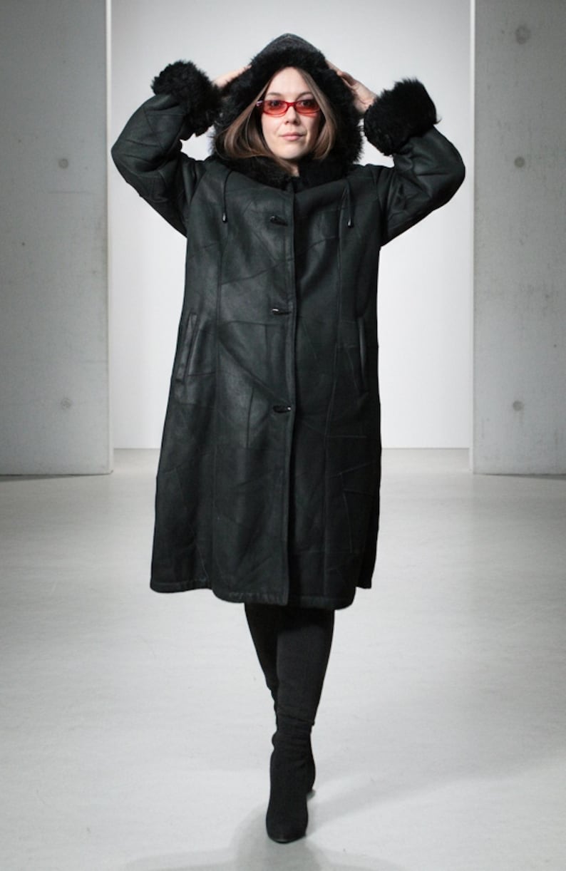 Hooded black shearling sheepskin coat with fur interior