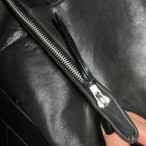 Large fold-over leather clutch bag with burgundy red interior