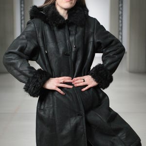 Hooded black shearling sheepskin coat with fur interior