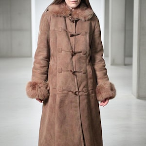 vintage brown sheepskin coat with shearling fur collar and hems