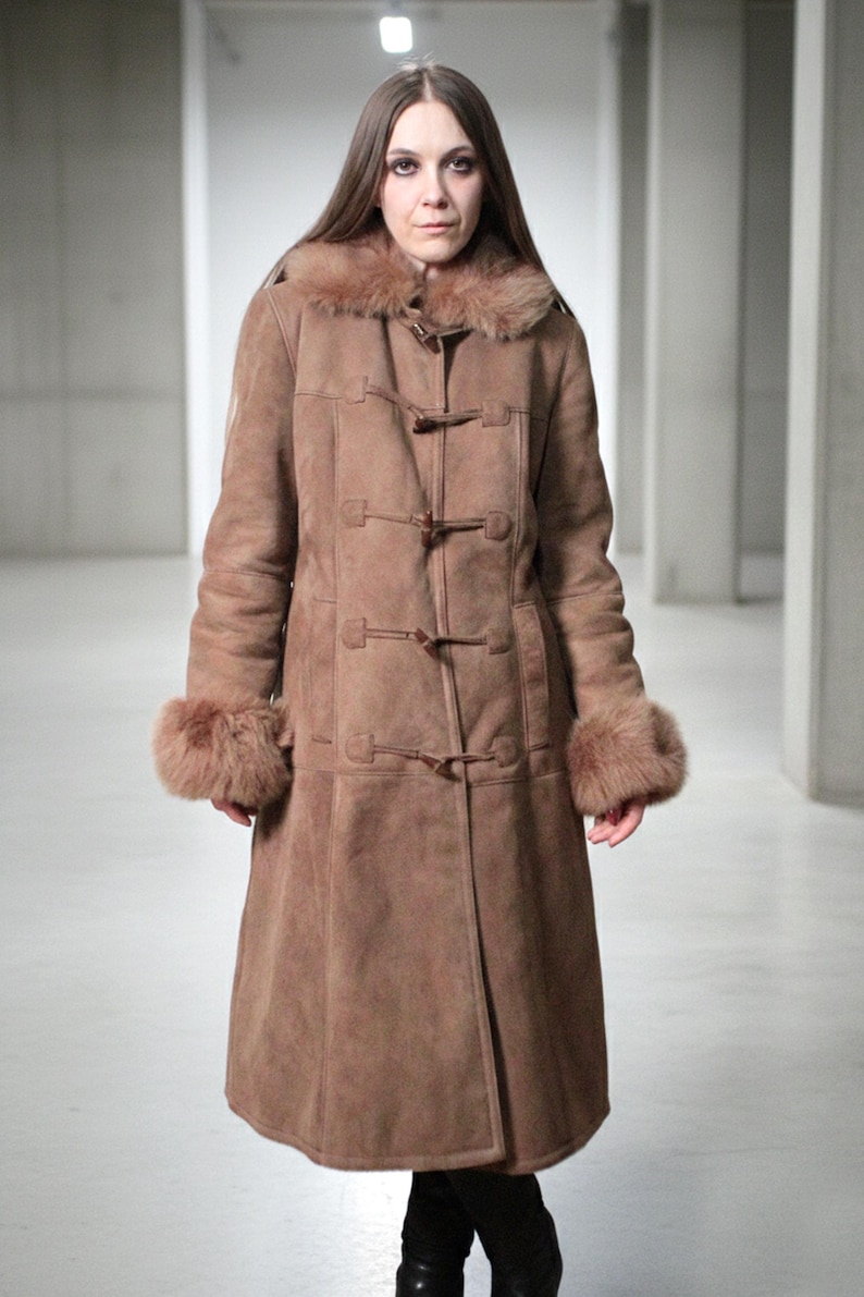 vintage brown sheepskin coat with shearling fur collar and hems