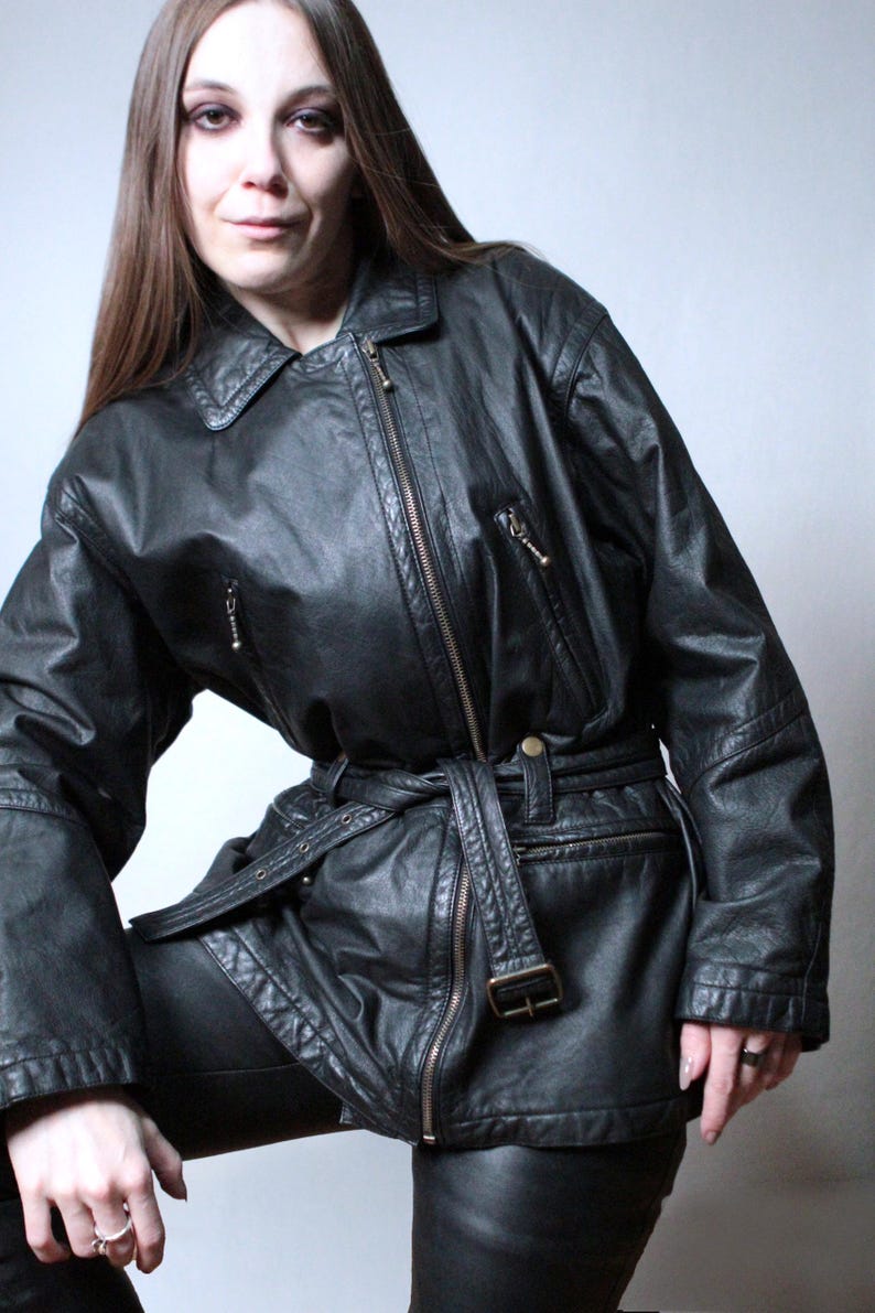 Vintage black leather jacket with a belt