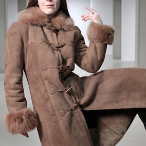 vintage brown sheepskin coat with shearling fur collar and hems