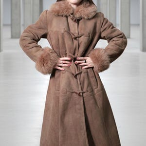vintage brown sheepskin coat with shearling fur collar and hems