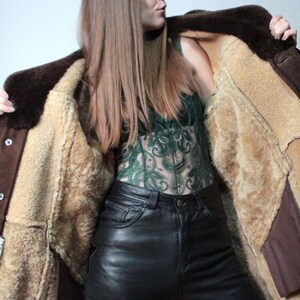 mens brown sheepskin coat with large collar and beige shearling interior