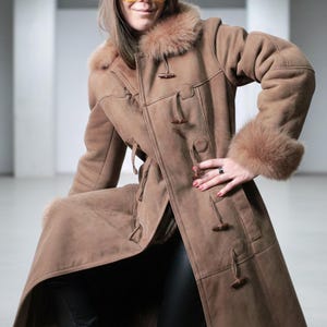 vintage brown sheepskin coat with shearling fur collar and hems