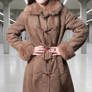 vintage brown sheepskin coat with shearling fur collar and hems