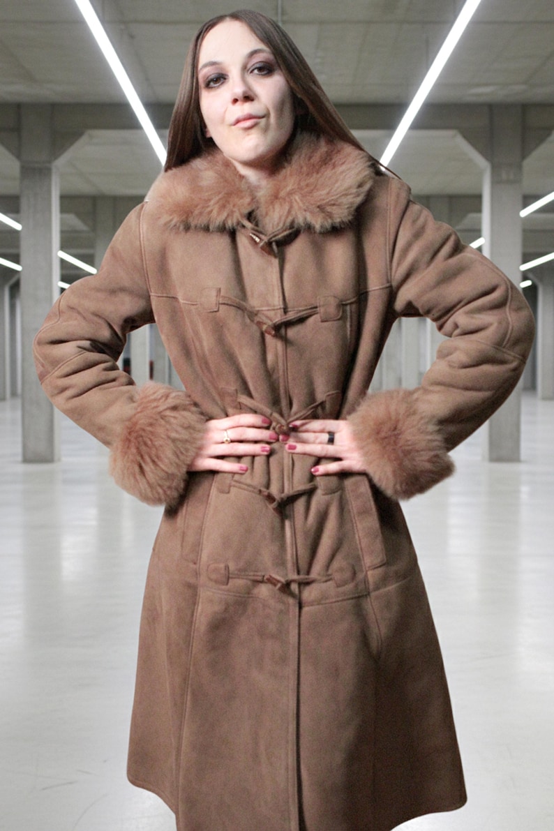 vintage brown sheepskin coat with shearling fur collar and hems