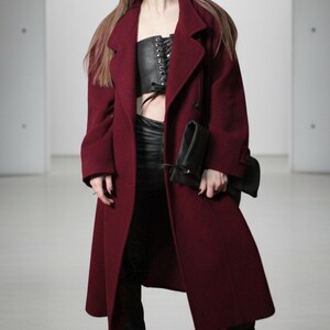 Large fold-over leather clutch bag with burgundy red interior