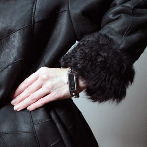 black patchwork sheepskin coat with black fur shearling