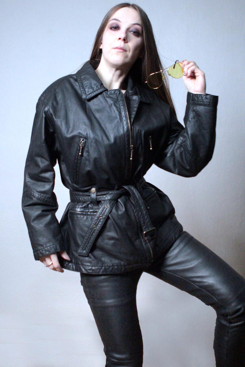 Vintage black leather jacket with a belt