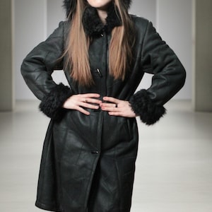 Hooded black shearling sheepskin coat with fur interior