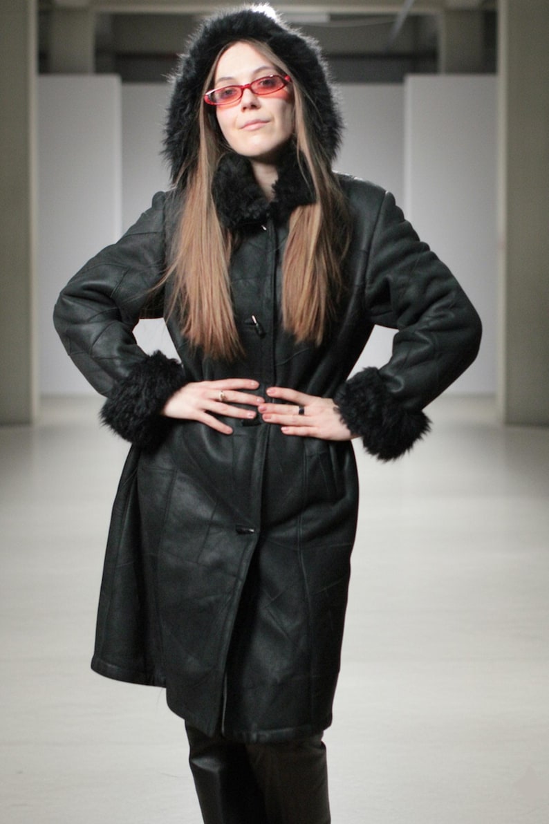 Hooded black shearling sheepskin coat with fur interior