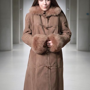 vintage brown sheepskin coat with shearling fur collar and hems