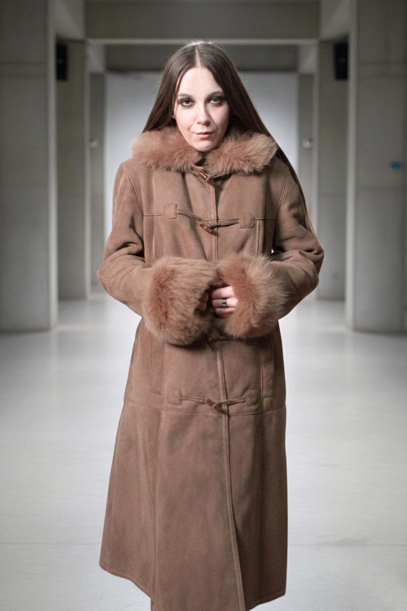 vintage brown sheepskin coat with shearling fur collar and hems