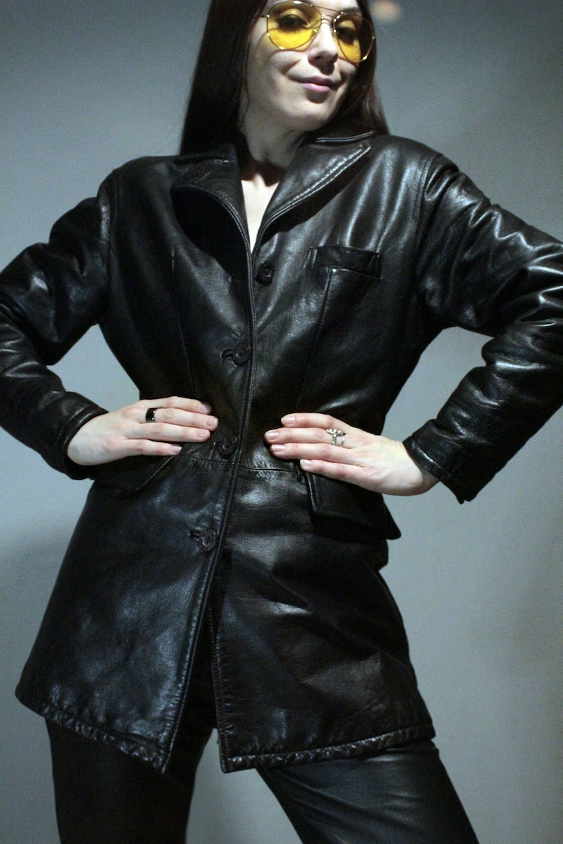 Vintage black leather jacket with high waisted leather pants and aviator sunglasses