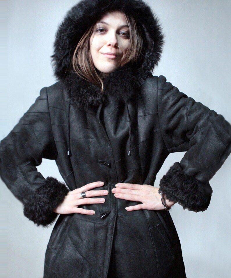 Long black shearling coat with removable hood