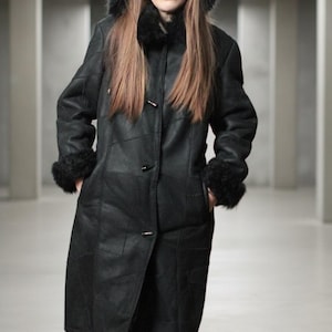 Hooded black shearling sheepskin coat with fur interior