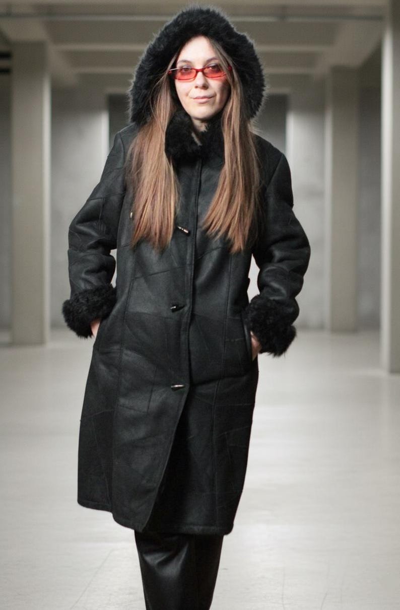 Hooded black shearling sheepskin coat with fur interior