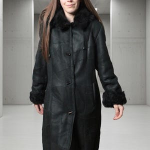 Hooded black shearling sheepskin coat with fur interior