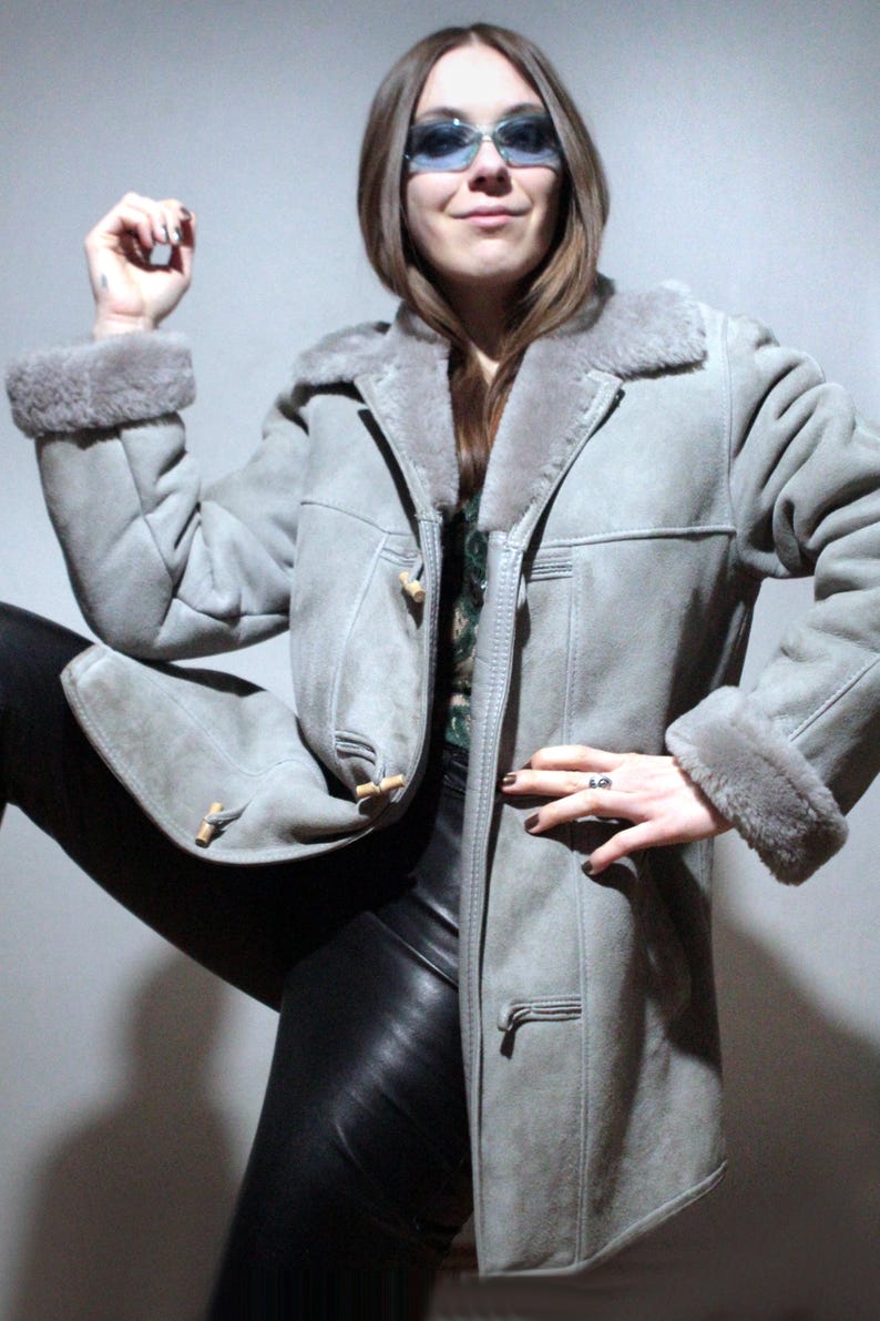 oversized sheepskin jacket with grey shearling interior and wooden buttons
