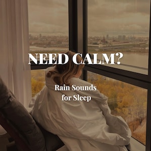 May include: A person wrapped in a white blanket looks out a large window with the text "NEED CALM?" and "Rain Sounds for Sleep". The window overlooks a cityscape and a river with fall foliage.