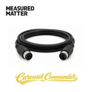 May include: Black MIDI cable with two 5-pin DIN connectors. The cable is coiled and lies on a white background. The text "MEASURED MATTER" is at the top, and "Carousel Commander" is at the bottom.