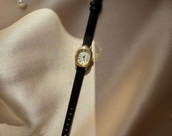 Women's wristwatch with black leather strap