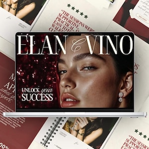 Op de afbeelding: Een zilveren laptop toont de tekst "ÉLAN & VINO" boven het gezicht van een vrouw, met "UNLOCK your SUCCESS" eronder. Rondom de laptop liggen notitieboekjes en kaarten met tekst en afbeeldingen.