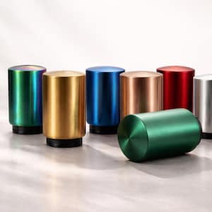May include: A selection of cylindrical bottle openers in metallic colours: green, gold, blue, copper, and red. One opener is on its side. Each opener has a black base. The openers are made of metal.