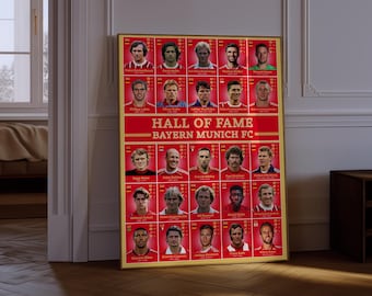 May include: A framed poster displaying the Bayern Munich FC Hall of Fame. The poster has a gold frame and a red background with player portraits. The text "HALL OF FAME" and "BAYERN MUNICH FC" are clearly visible.