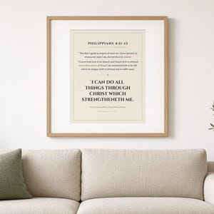 May include: A framed wall art print featuring the text of Philippians 4:11-13 in black serif font on a cream background. The print includes the verse text and the prominent quote, I CAN DO ALL THINGS THROUGH CHRIST WHICH STRENGTHENETH ME.