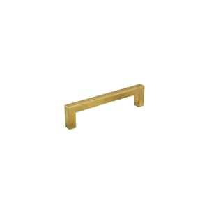 May include: A gold-colored, rectangular cabinet pull handle. The handle has a square, modern design and is made of metal. The handle is shown against a white background. This hardware is suitable for drawers and cabinets.