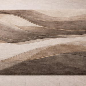 May include: A rectangular area rug with a flowing, wave-like design in shades of brown, beige, and tan. The rug's pattern creates a sense of movement and depth, suitable for living rooms or bedrooms. The rug is made of a soft material.