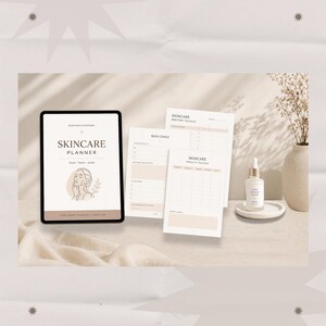 May include: A digital tablet displaying a Skincare Planner with a line-art illustration of a face, alongside three printed planner pages titled Skincare Routine Tracker, Skin Goals, and Skincare Product Tracker, plus a small glass serum bottle.