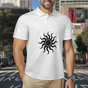 May include: White polo shirt featuring a black sunburst design on the front. The shirt has a classic collar and button-up placket. The sunburst design is centered and has a circular center with curved rays extending outward.