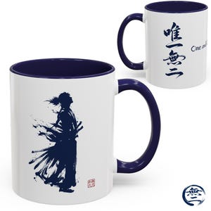 May include: White ceramic mug with a navy blue interior and handle. The mug features a dark blue silhouette of a samurai warrior with Japanese characters and the words "One and Only" printed on the side.