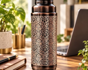 May include: A cylindrical copper water bottle featuring a dark, burnished finish and a prominent, intricate embossed damask pattern wrapping around the center. The bottle has a smooth, rounded base and a threaded neck with a matching copper cap.
