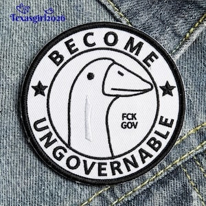 May include: A round, white patch with a black border and text that reads "BECOME UNGOVERNABLE." The patch features a cartoon goose head in the center, with the text "FCK GOV" below. Two black stars flank the goose.