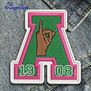 May include: A white ceramic mug with a black handle and the text "But First, Coffee" in a black, handwritten-style font. The mug is on a white surface.