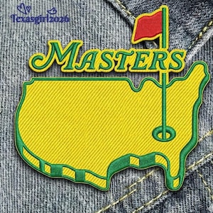 May include: Embroidered patch featuring the word "MASTERS" in green and yellow, with a red flag on a green pole. The patch is in the shape of the United States, with a yellow background and green border. The patch is on a denim background.