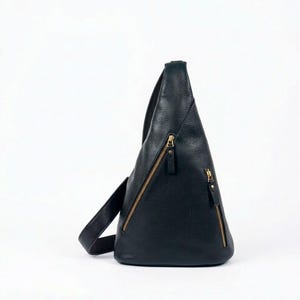 May include: A white ceramic mug with a black handle and the text "But First, Coffee" in a black, bold font. The mug is on a white surface. The mug is approximately 4 inches tall.