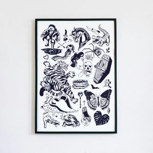 May include: Black and white framed art print featuring a collection of tattoo-style illustrations. The artwork includes a tiger, horse, alligator, spider, butterfly, coffin, and other classic tattoo motifs. The print is displayed against a white wall.