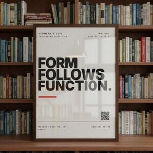 a framed poster with the text "FORM FOLLOWS FUNCTION." in bold, black letters. The poster is displayed in front of a bookshelf filled with various books.