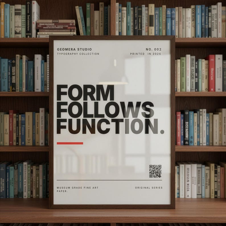 a framed poster with the text "FORM FOLLOWS FUNCTION." in bold, black letters. The poster is displayed in front of a bookshelf filled with various books.