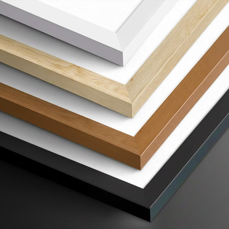 A collection of various colored wooden frames, including white, light brown, dark brown, and black, arranged in a visually appealing manner.