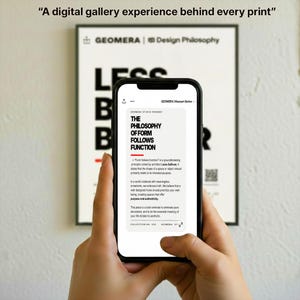 A person's hands holding a smartphone displaying a text article or webpage, with a large sign or poster in the background that says "A digital gallery experience behind every print".