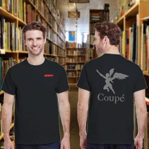 May include: Black t-shirt with the red letters "SDN" on the front. The back of the shirt features a gray graphic of a winged figure and the word "Coupé" in gray. The shirt is short-sleeved.
