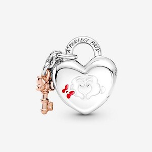 May include: A silver heart-shaped charm with a key. The charm has the words "A PERFECT PAIR" and a design of two hands forming a heart with red accents. The key is rose gold.